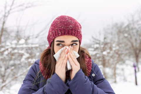 young-woman-sick-sneeze-into-tissue-paper-girl-blowing-nose-outdoors-catching-cold-winter-upset-gloomy-woman-with-ill-expression-sneezes-has-running-nose